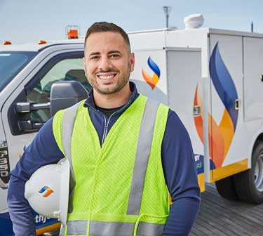 Happy SJG Employee next to his truck